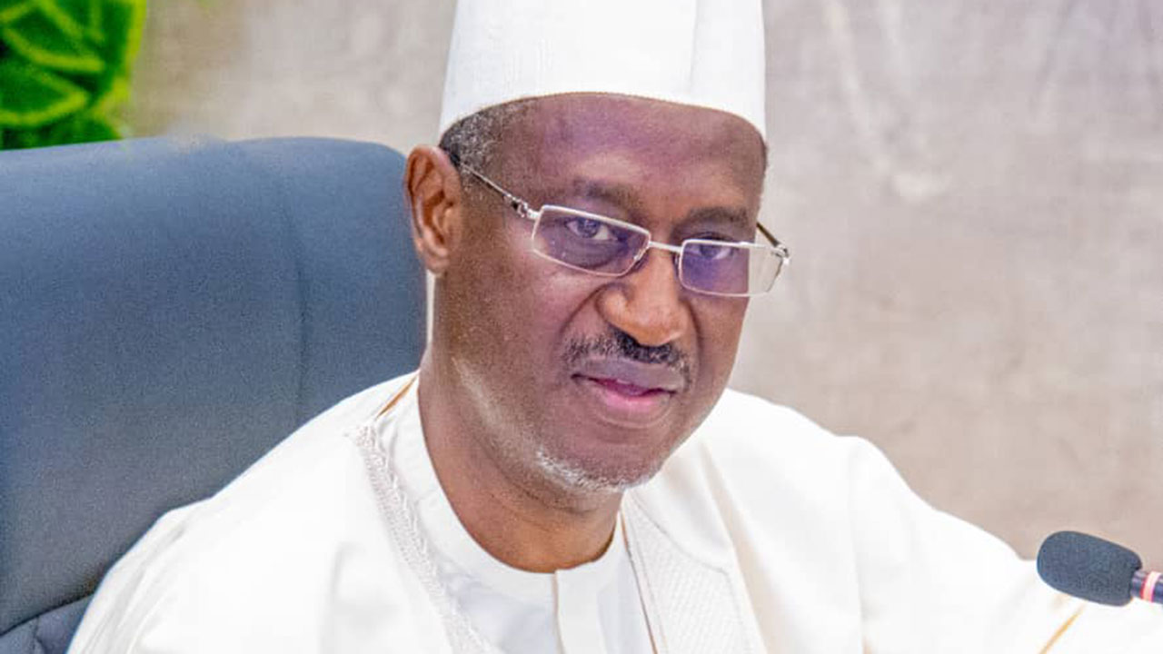 a man in a white hat and glasses